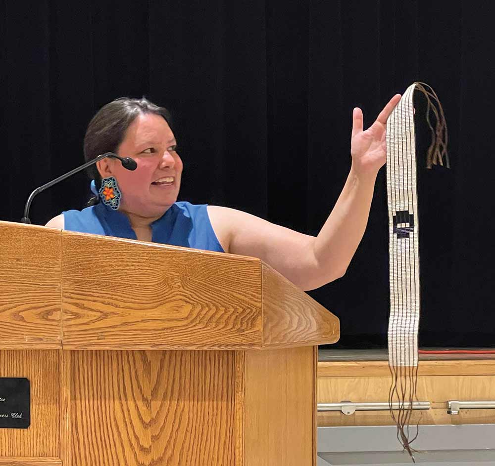 Dawnis Kennedy holds a replica of the One Bowl, One Spoon Treaty, or wampum belt. Every bead is a prayer.
Photo by Lori Penner/Voice