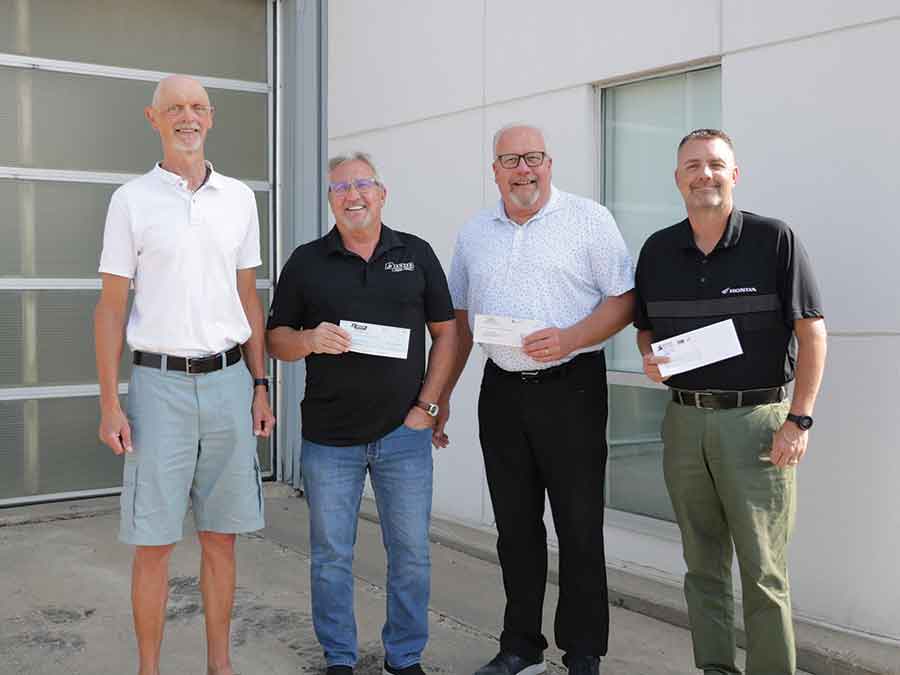 John Loewen from the Stanley Trail Association accepted donations from Paul Janzen, Bob Derksen, and Jody Hildebrand of the Winkler Auto Dealers group last week for the in-progress Stanley Community Pathway
