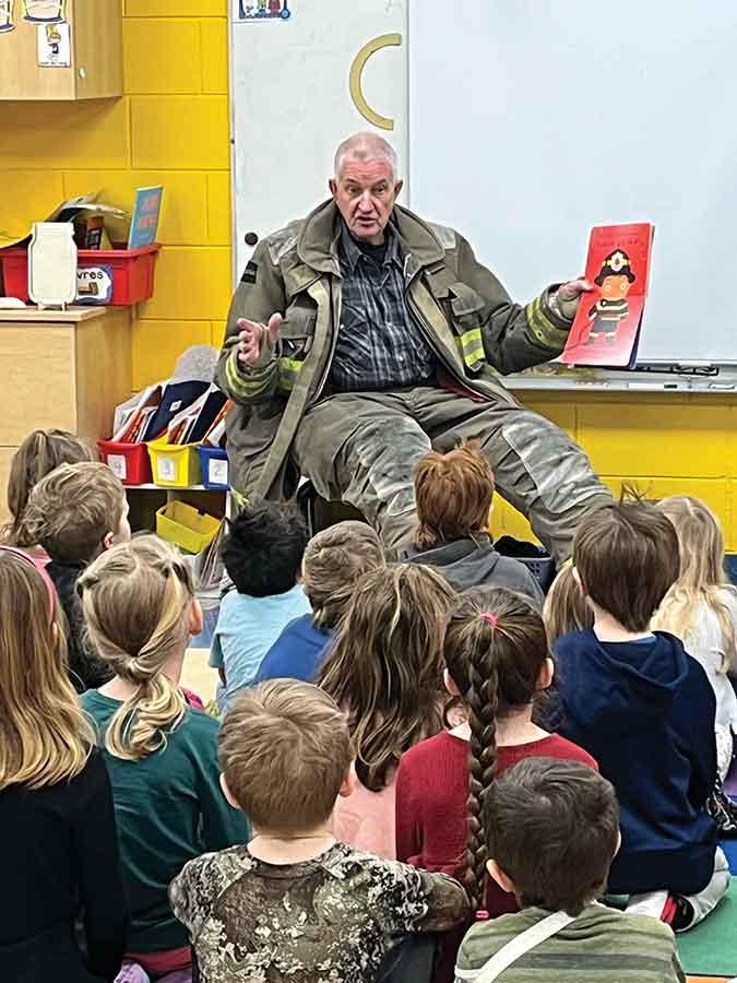 Martin Dewit shares fire safety stories with students during I Love to Read Month, combining books, humour and hands-on demonstrations to help children learn how to stay safe