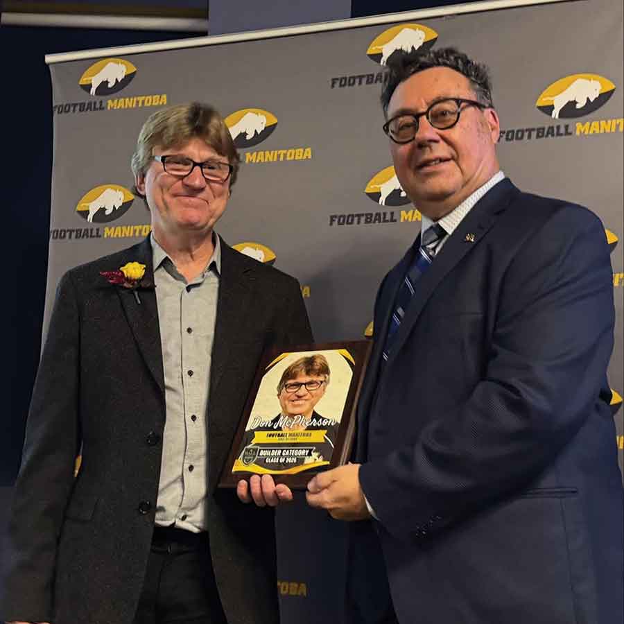 St. Andrews’ Don McPherson, left, shares the moment with Mike Garlinski at the Football Manitoba Hall of Fame Induction Dinner on Sept. 25 at the Pinnacle Club at Princess Auto Stadium in Winnipeg. McPherson was honoured for his decades of leadership in community football
