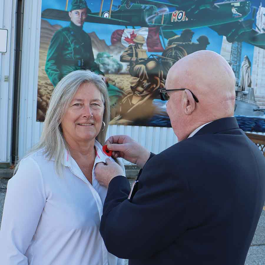 Royal Canadian Legion Branch No. 52 president Ken Power pins the first poppy on Town of Stonewall Mayor Sandra Smith on Friday, marking the start of the 2025 poppy campaign. The annual initiative raises funds to support veterans and their families in the community
