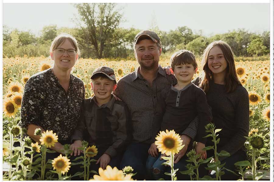 The Darknell family — Arlene, Skuli, David, Odinn and Freya — at their sunflower field near Eriksdale