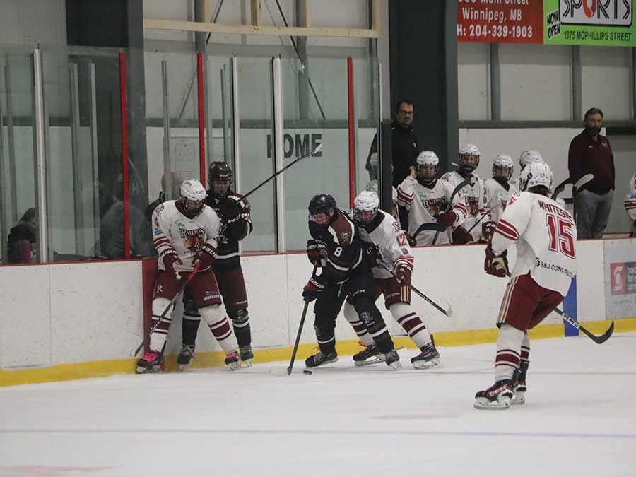 Sawyer Leite carries the puck along the boards as he looks to advance the play during weekend action against the Raiders