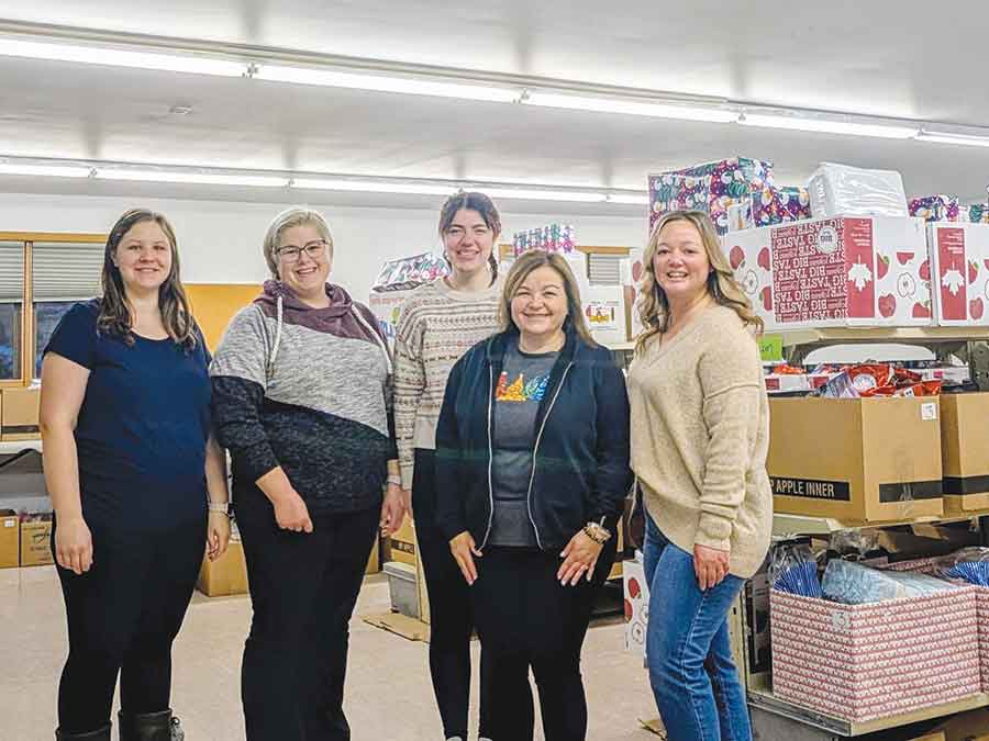 Volunteers with the Arborg & District Christmas Cheer Board, left to right, Morgan Stobert, Tammy Ciemny, Courtney Barkman, Noreen Barkman and Evanie Palardy, gather as they prepare for another busy season of sorting, packing and delivering holiday hampers for local families