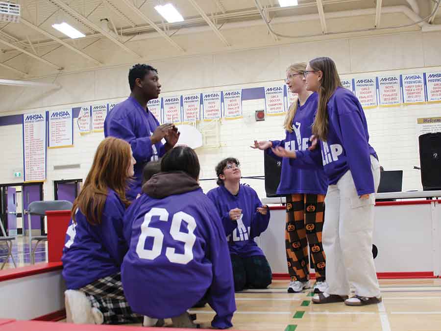 Members of the Collège Stonewall Collegiate French improv team perform during the Oct. 30 FLIIP tournament in the school gym. The improvisational league offers French immersion students an opportunity to practise their language skills in a creative and collaborative setting