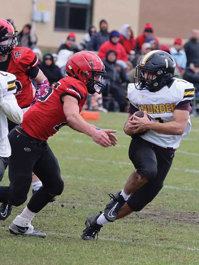 Winnipeg Beach’s AJ Nadon powers through the defence as the ball carrier