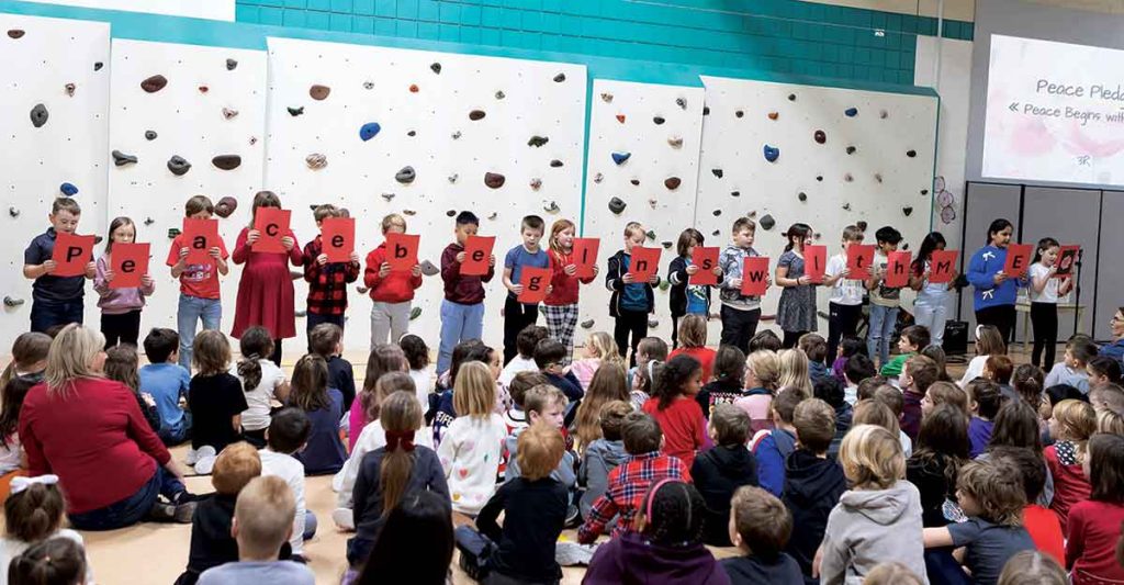 Students participated in the Peace Pledge, spelling out the message “Peace begins with me” during the school’s Remembrance Day assembly