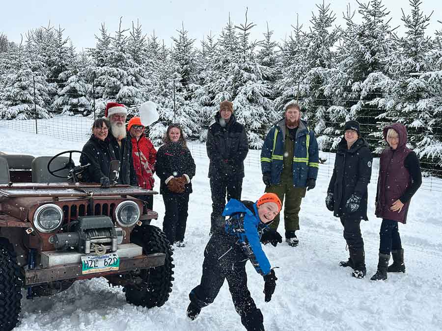 Garry and Wendy Martens, owners of Mount Nebo Tree Farm, are joined by their staff as they help create lasting Christmas memories for visiting families