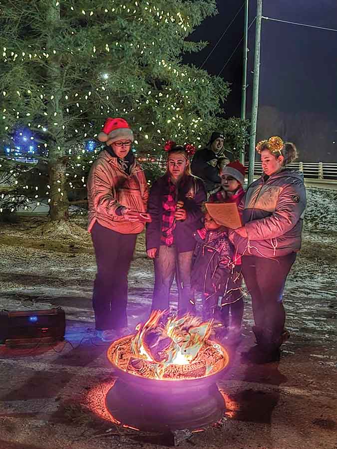 Carollers, Tina, Ryelle, Aurelia, Hadley and Dahlia Brill gathered around an open fire during Arborg’s annual tree-lighting ceremony on Nov. 28, filling the evening with music, warmth and holiday cheer