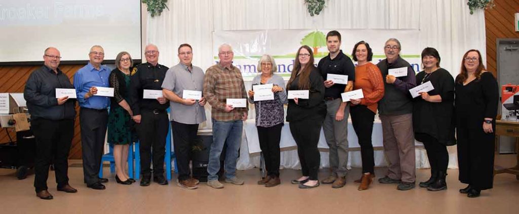 Award recipients gather for a photo during the community’s 25th-anniversary business awards celebration, held Nov. 15. The event recognized outstanding achievement and contributions to local economic growth