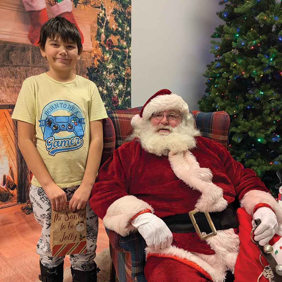 Emmy and Jolene of Lake Francis enjoyed a festive encounter with a friendly reindeer, while Rylan of St. Laurent shared a cheerful moment with Santa during the Breakfast with Santa event in Lake Francis on Sunday, Dec. 7. Families gathered for holiday fun, photos and Christmas spirit throughout the morning