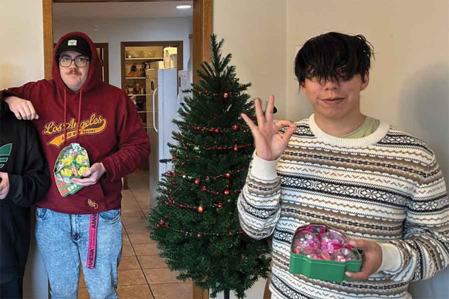 Devin Williams (left) and Brandon Black with the Christmas ornaments they and other Linden Place residents made and are selling to raise funds for Eden Foundation