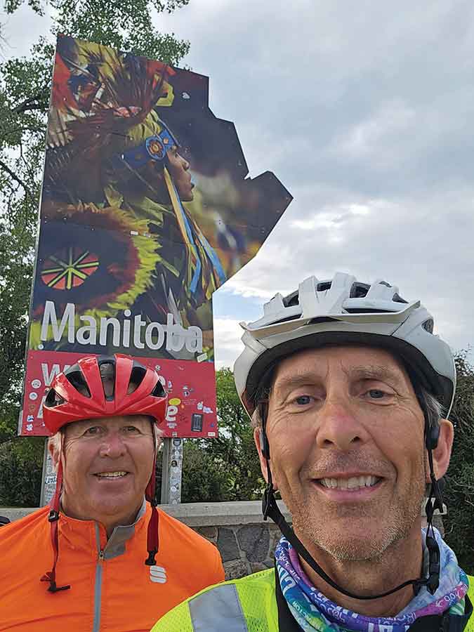 Hoess (right) with his friend, Dwight, who made the 2400-kilometre bike ride with him