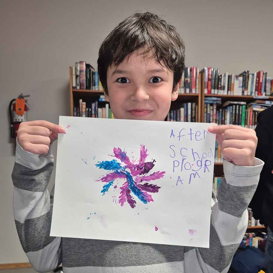 Mason with his art that he created