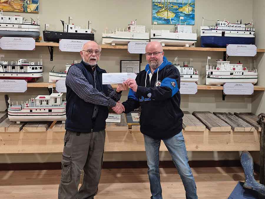 Municipality of Bifrost-Riverton deputy reeve Chad Johnson (right) received the $10,000 cheque from Don Fletcher from MASC/Age Friendly Manitoba
