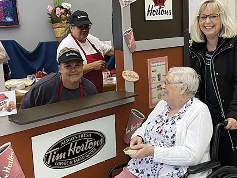 From left Trista Allbutt, Therapeutic Recreation Facilitator, Sandy Boyer, Therapeutic Recreation Facilitator, Gail (resident) and Gail’s daughter Lisa