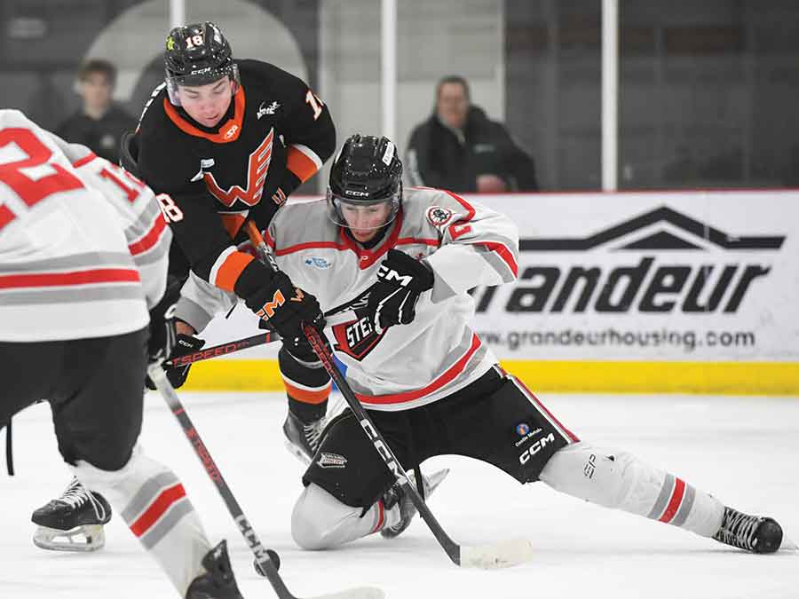 Steelers defenceman Ayden Collins works to deny Flyers forward Tanner George a shot on goal