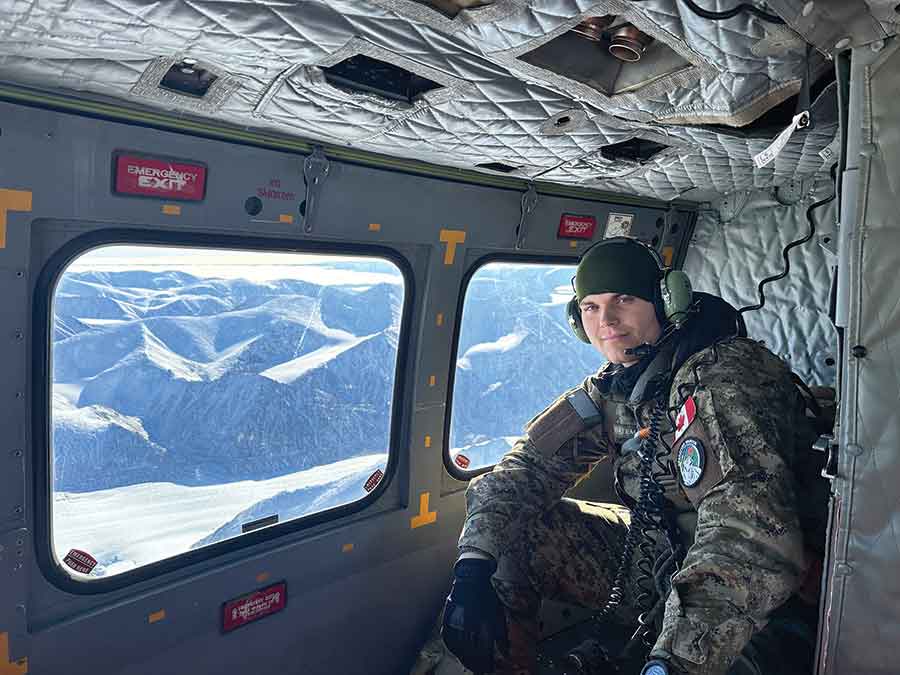 Bateman flies over Bylot Island, Nunavut during a helicopter recce