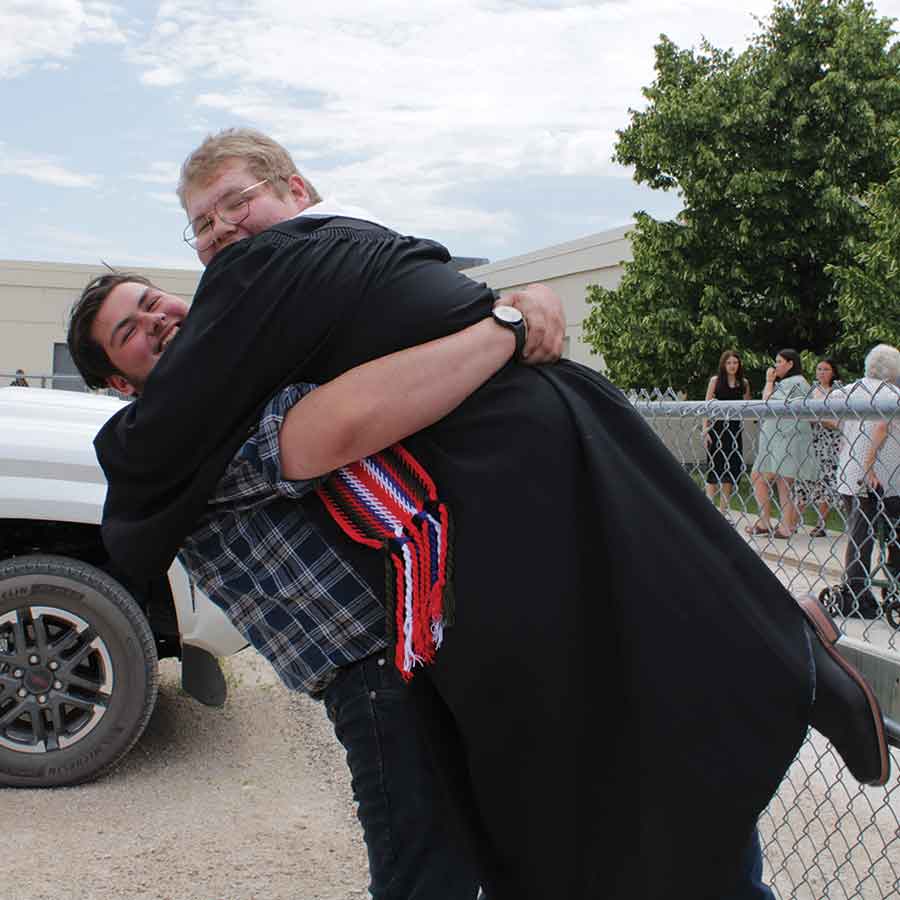 Graduate Ayden Munro was eager to celebrate with his best friend, Jul
