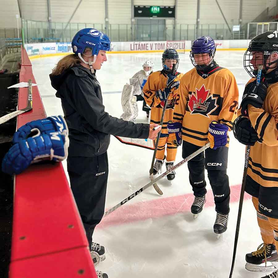 Megan Humeniuk coaches behind the bench at the World Selects Invitational in Prague, where she led the U15 WestCan Prime female team and represented Play Hockey on the international stage