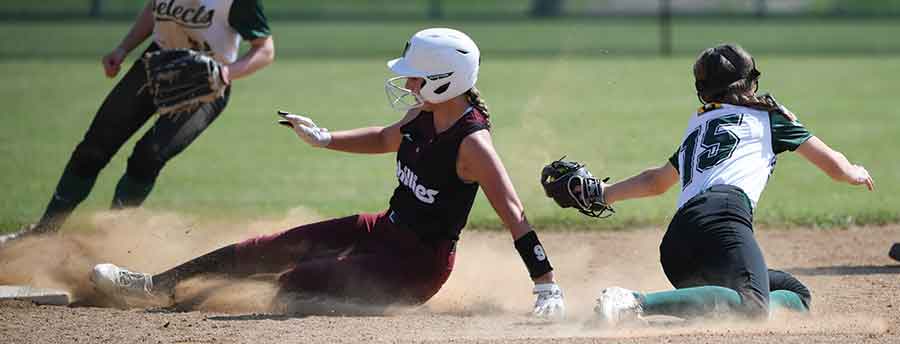 Interlake Phillies Paige Bernier slides into second base beating the tag by BC Selects Marika LeBlanc