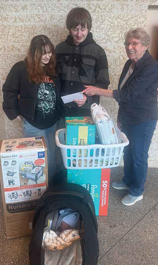 Arielle Marshall and Tanner Wachal accept a New Year’s baby gift from Selkirk Hospital Gift Shop volunteers chair Betty Milkowski for their son Arthur, born Jan. 3 at Selkirk Regional Health Centre