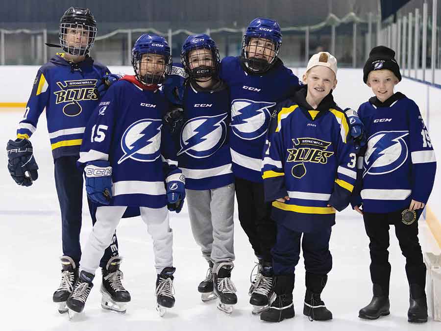 Warren Minor Hockey players Austin Mulligan, Brayden Hueging, Kaleb Koss and Blake Beachell purchased pucks for the chuck-a-puck contest, which ran between the second and third periods