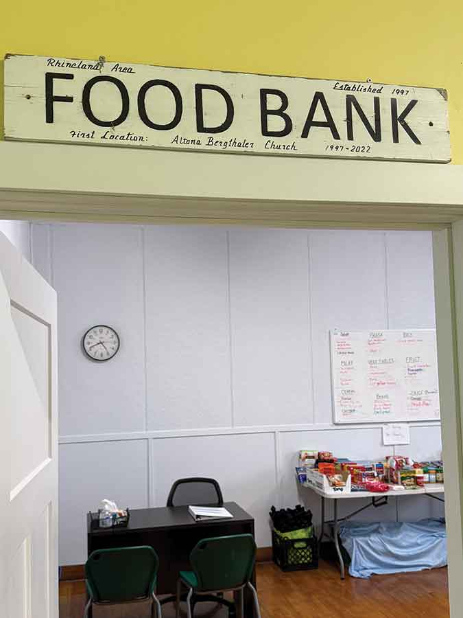 The original hand lettered sign from when it started in 1997 greets visitors to the Rhineland & Area Food Bank, now operating in space at the Altona United Church
