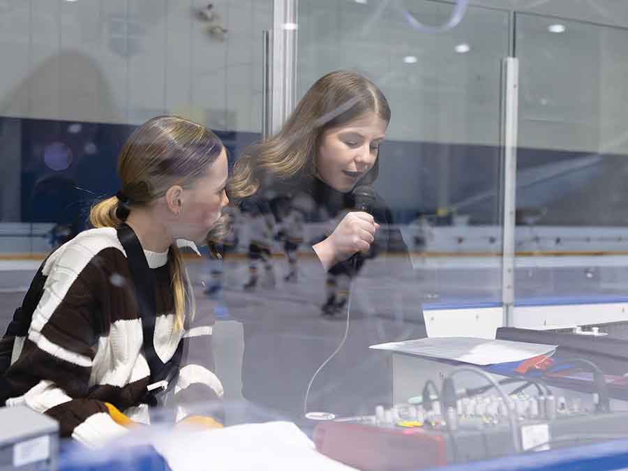 Grosse Isle School students Molly Beachell and Cooper Darragh served as announcers for the game