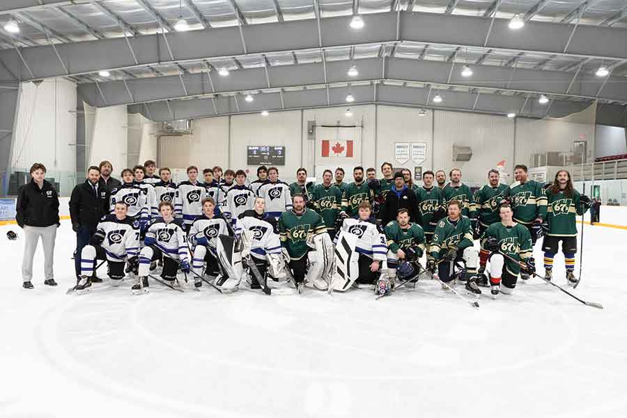 The Warren Wildcats boys team and coaching staff and the WCI 2014-2016 alumni team and coach Sean Martin