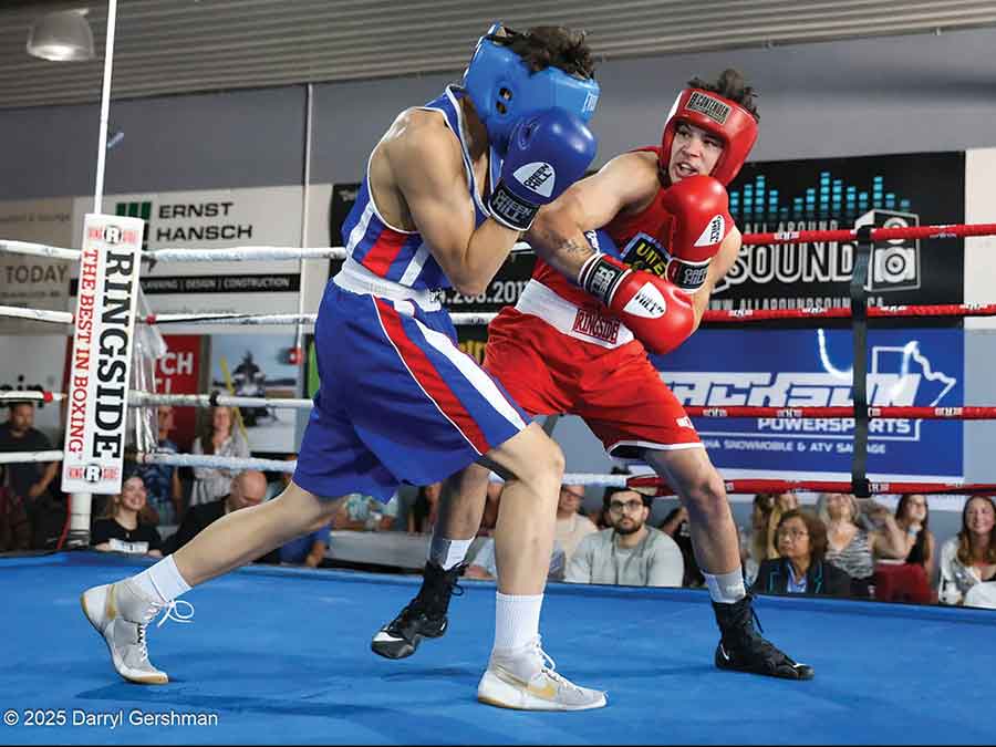 Tyler Oleksiuk of Stonewall, right, lands a punch on Wrenn Peters during their bout