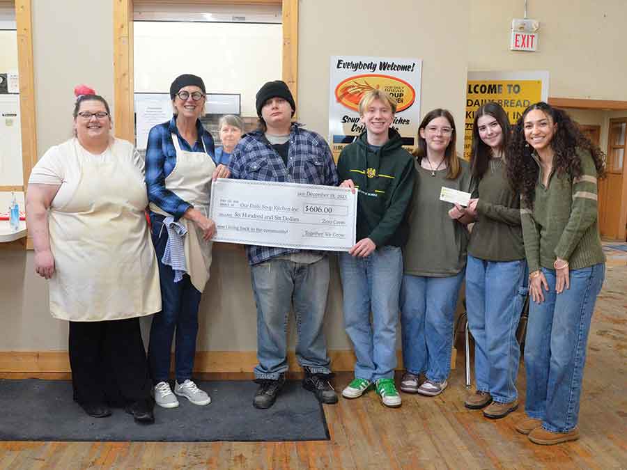 Our Daily Soup Kitchen volunteers Shannon Paskaruk, Barb Pasaur, Nancy Desrosiers, and Austin McDuff with LSRCSS students Mia Evashenko, Quinn Fyfe, Sarah Grauman, and Selina Kermani as the students made their cheque presentation