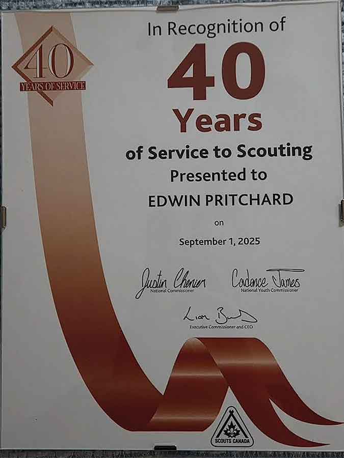 Pritchard’s plaque recognizes 40 years of volunteer service and leadership with Carman Scouts
