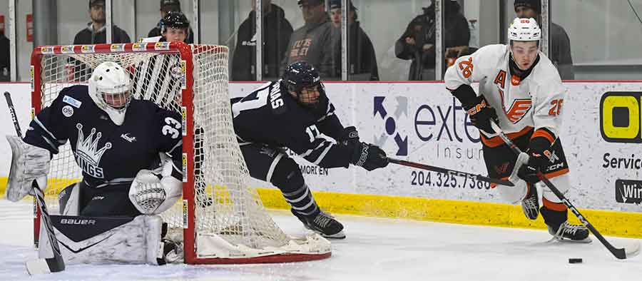 Winkler’s Niklas Gudmundson carries the puck around behind Dauphin netminder Bryson Yaschyshyn in Sunday’s 5-1 Flyers victory
