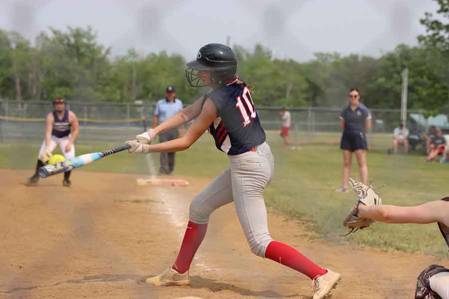 Brielle Thiessen connects with the ball in her teams’ 5-1 loss to the Stonewall Rams in the MHSAA softball provincials bronze medal game