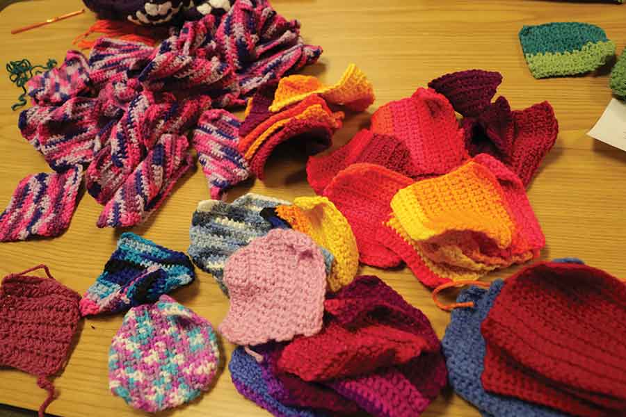 Some of the granny squares last week’s crochet-a-thon generated for the Afghans for Eden program at the Winkler library. Left: They have take-home kits available for anyone wanting to get involved with this project, which runs year-round