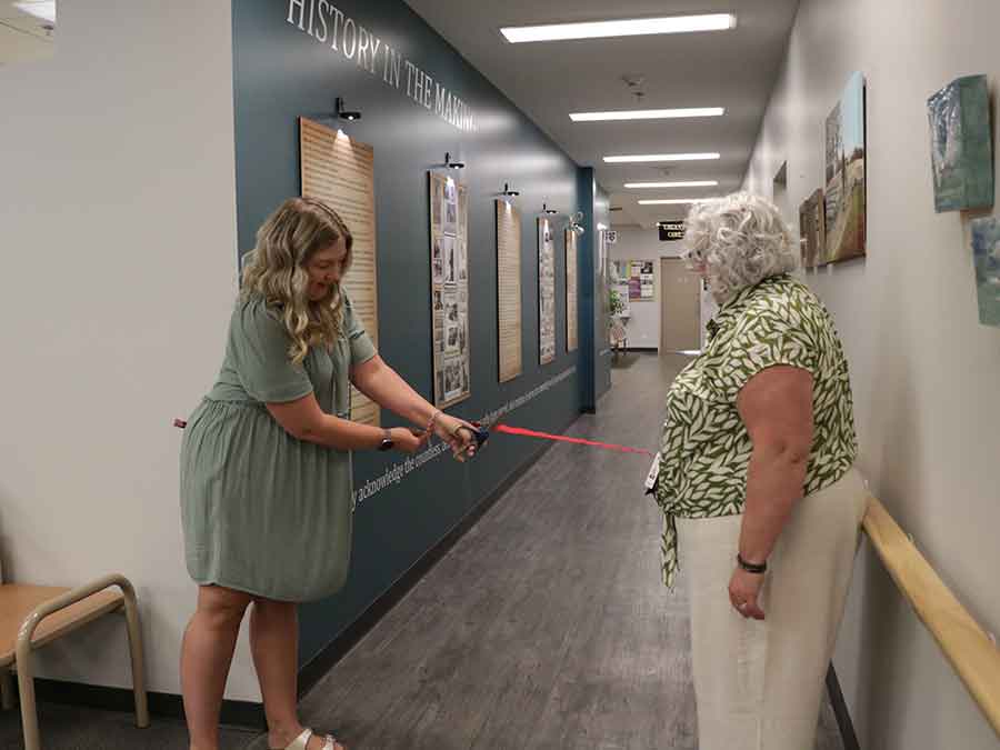 Dr. Tanja Borchers and clinic executive director Karen-Denise Cyr cut the ribbon on the new tribute wall