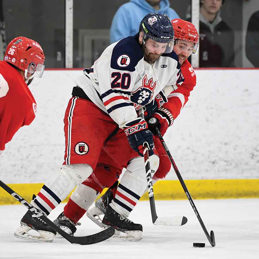The SEMHL scoring leader and Winkler’s Aaron Lewadniuk controls despite the defensive efforts of a Notre Dame player