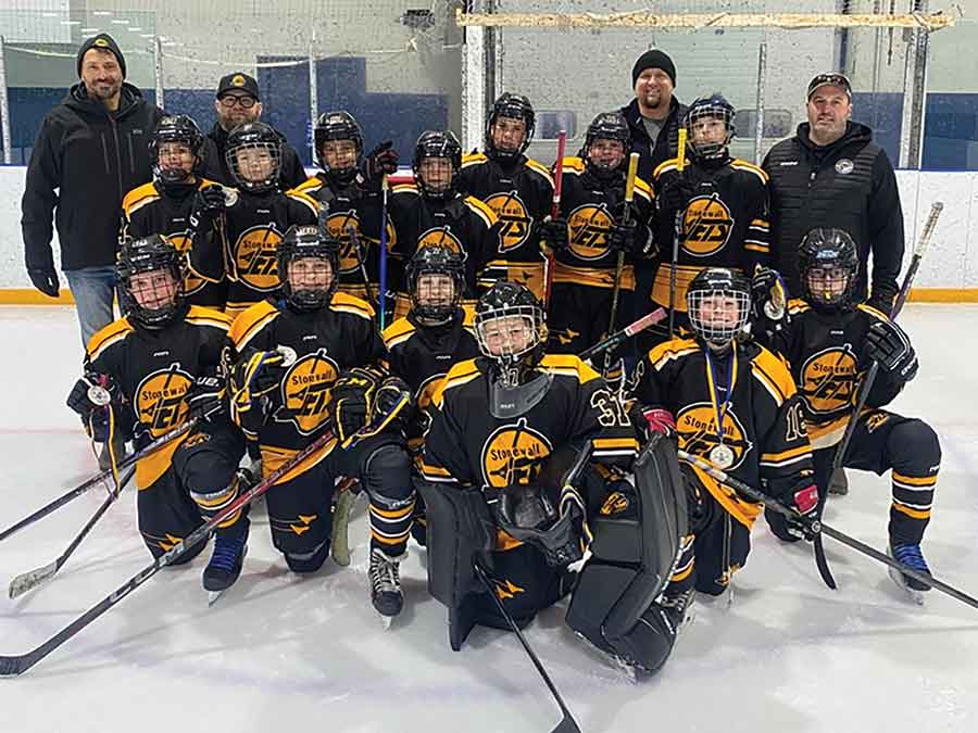 The Stonewall Junior Jets A1 team captured silver medals at a recent tournament, finishing runner-up after a 5–2 loss to TSN in the final. The Jr. Jets advanced with wins over the Seven Oaks Raiders (7–5), Rat River Saints (11–4), Winkler Flyers (9–1) and Transcona Regents (5–2). Pictured, left to right, back row: John Favreau (assistant coach), Shaun Dalgliesh (head coach), Byron Scrivens (assistant coach) and Matt Wutzke (assistant coach). Middle row: Mason Truthwaite, Dane Fortin, Beckett Buchko, Connor Van Hussen, Jack West, Nash Scrivens and Kolson Jira. Front row: Tucker Wutzke, Colton Harrisko, Ethan Favreau, Camden Sowa, Jackson Oatway and Max Slobodzian