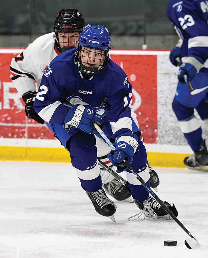 Interlake Lightning defenceman Logan Jacobson leads the rush up ice against the Pembina Valley Hawks