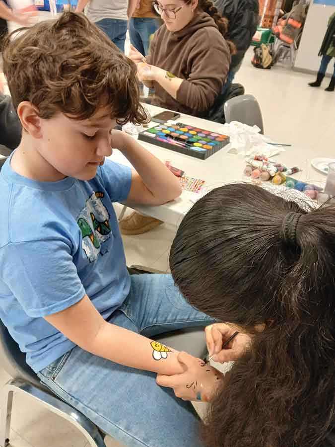 Jackson, 10, gets a bee tattoo