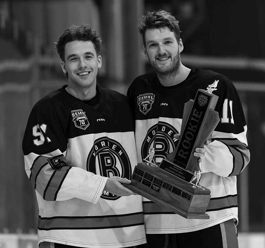 Morden’s Cade Kowalski (left) receives the 2025-26 SEMHL Rookie Of The Year Award from presenter and teammate Collin Shirley