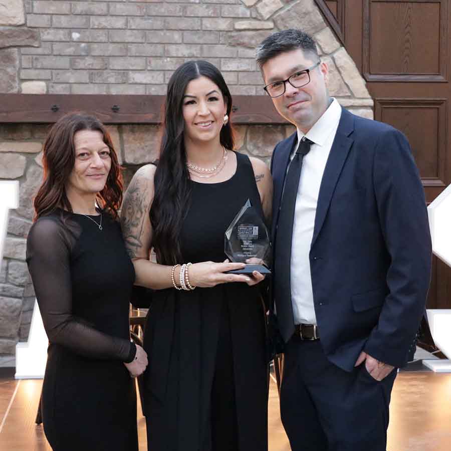 Mulligan’s Restaurant’s Sara Bueckert Andrea Knight, and Anthony Proulx with the Business Builder Award