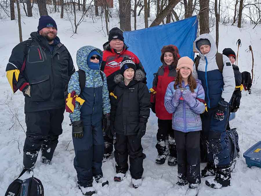 Members of the 1st Carman Beavers, Cubs and Scouts test their skills during the 54th annual Klondike Rally at Camp Amisk near Winnipeg. Teams completed a variety of challenges, including crossing a suspended rope bridge with their gear, building a fire to burn a rope using only one match and suspending their sled off the ground