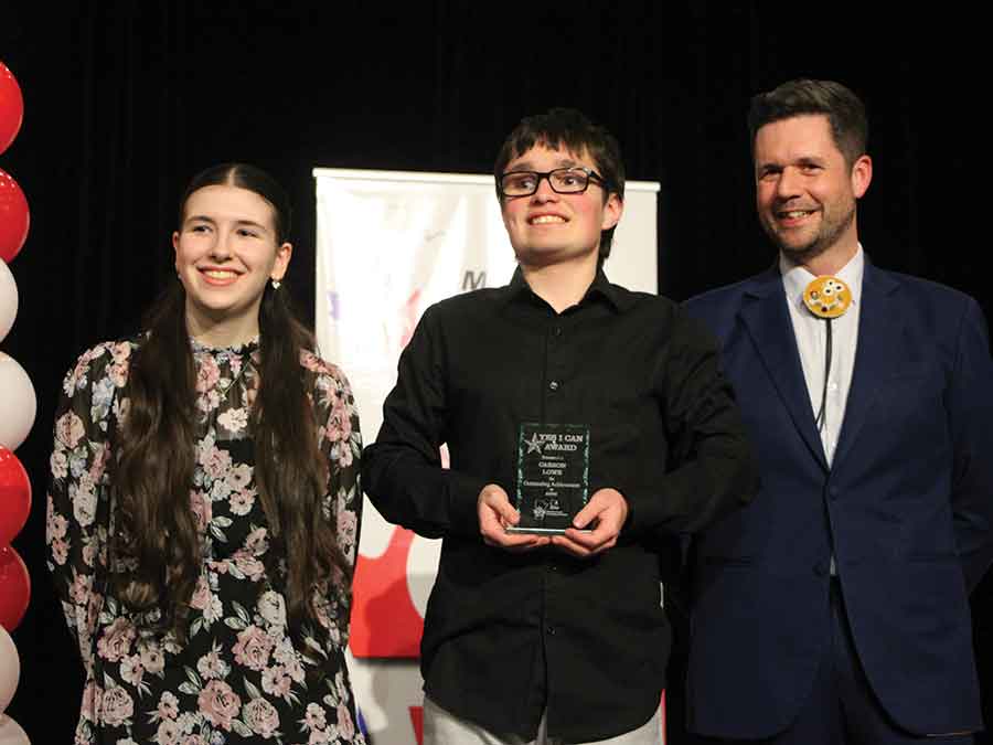 Award recipient Carson Lowe with friend Avila Robertson and Lagimodière MLA Tyler Blashko