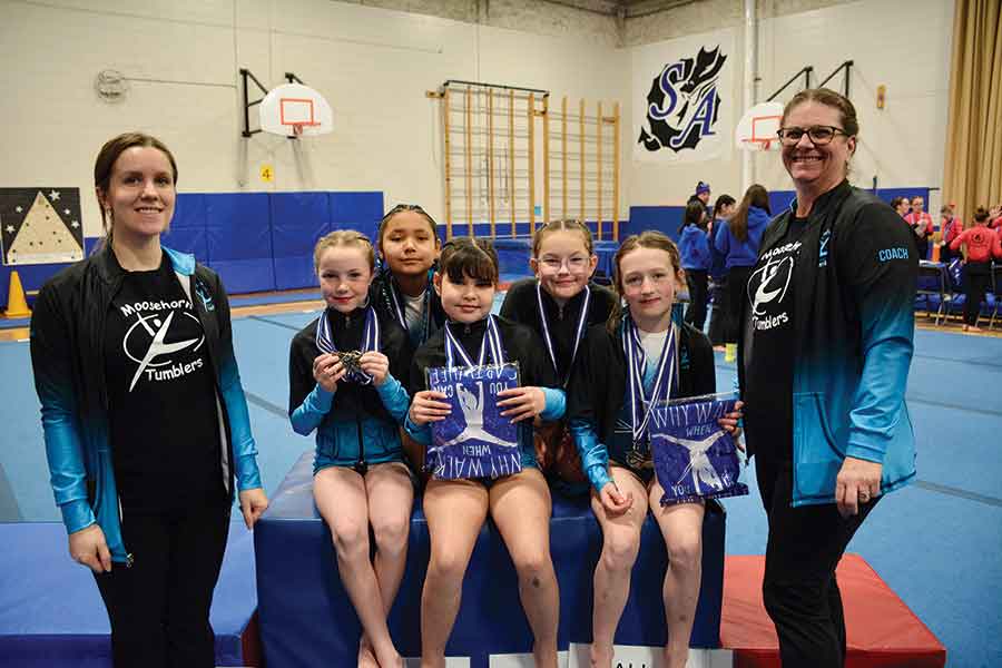 Coaches Jordan Granberg and Becky O’Sullivan with Canadian Competitive Program (CCP) level 2 and 3 gymnasts Sara Gall, Ellie Linski, Kennasyn Geisler, Willow Rawluk and Bryce Hoffman