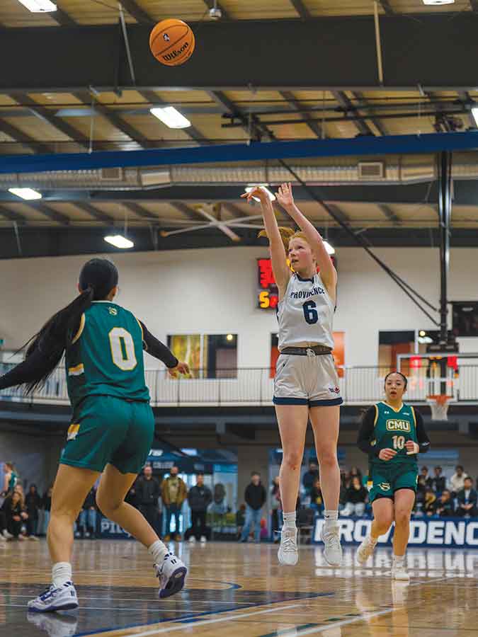 Providence’s Colby Darragh pulls up for a shot against the CMU Blazers. The freshman guard has posted per game averages of 6.1 points, 4.9 rebounds, and 1.7 assists this season for the MCAC Champion Pilots