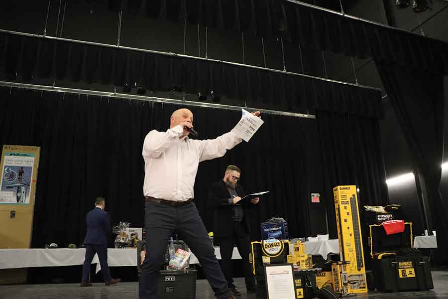 Stonewall Jets general manager Liam Wheddon calls for bids during the live auction portion of the team’s annual fundraising gala