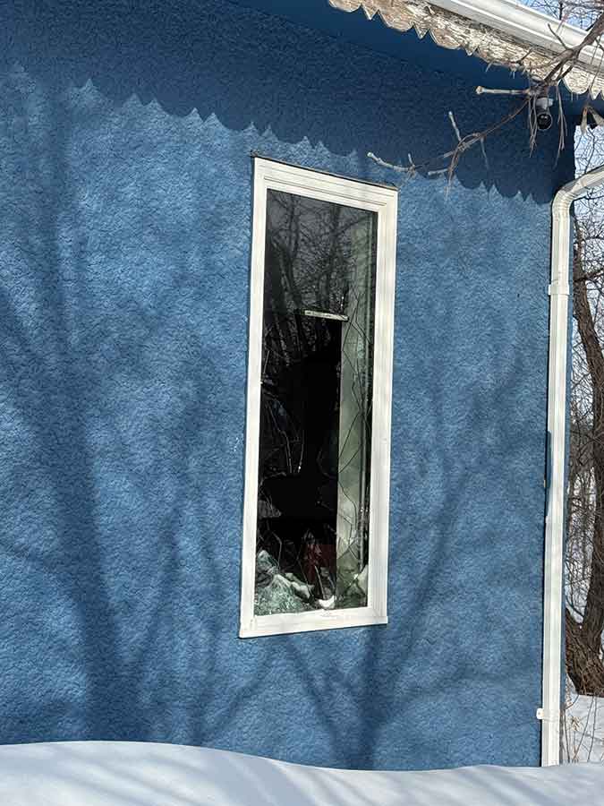 A broken window is seen at Craving Restaurant on 4 Street E in Stonewall following an attempted arson early Feb. 19