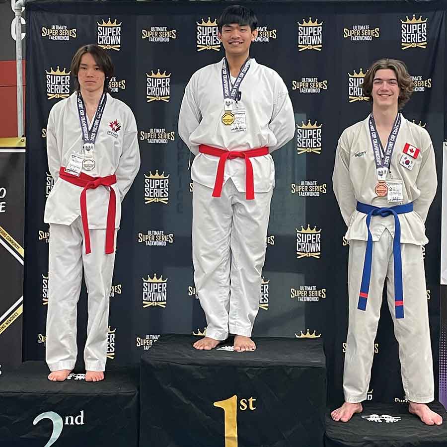 Kian Chimicag (middle), gold medallist for patterns